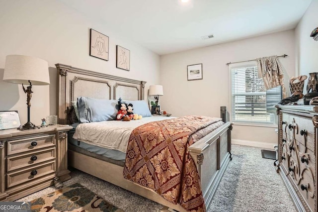 bedroom featuring dark carpet