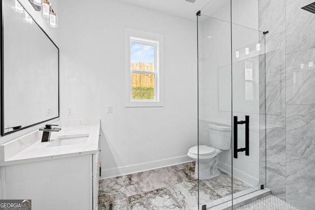 bathroom with toilet, vanity, and walk in shower