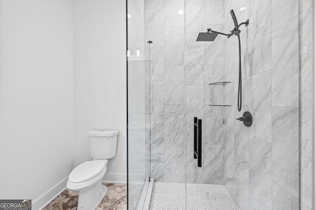 bathroom featuring walk in shower and toilet