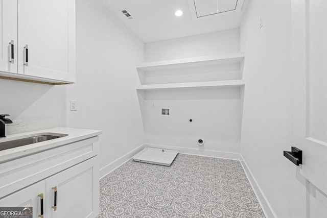 laundry room featuring cabinets, washer hookup, sink, and electric dryer hookup