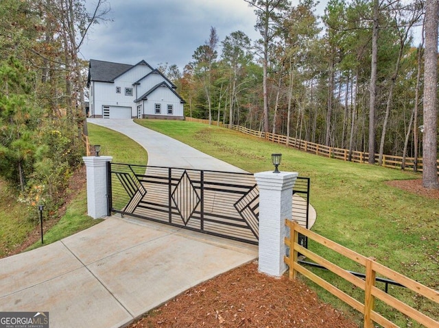 view of gate featuring a lawn