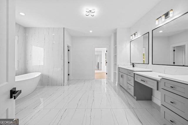 bathroom with vanity and a bathing tub