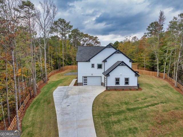 view of front facade featuring a garage and a front lawn