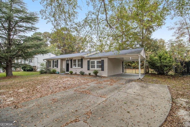 ranch-style house with a carport