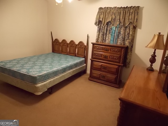 bedroom with light carpet