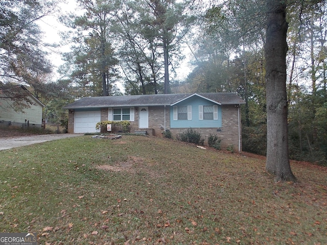 ranch-style home with a garage and a front yard