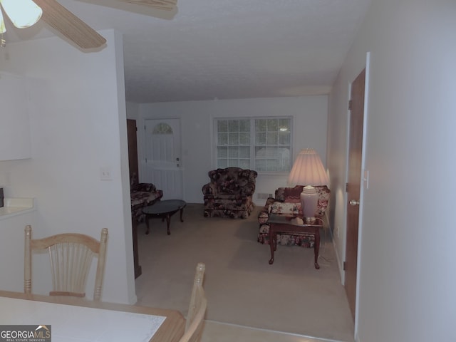 dining area featuring ceiling fan and carpet floors