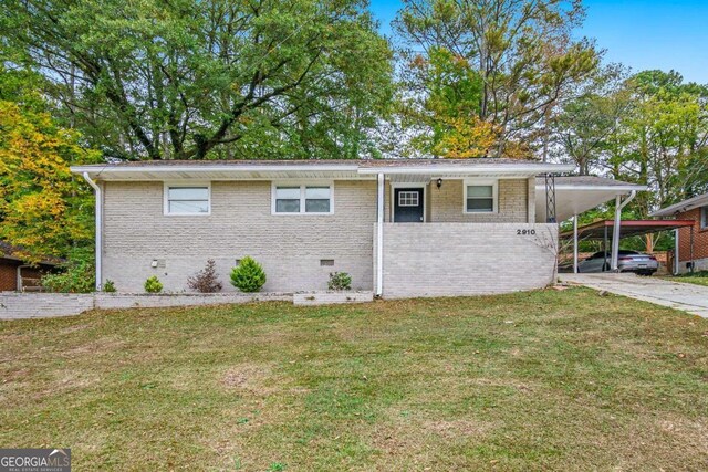2910 Delowe Dr, Atlanta, GA 30344 - view of front of house featuring crawl space, a front yard, concrete driveway, an attached carport, and brick siding