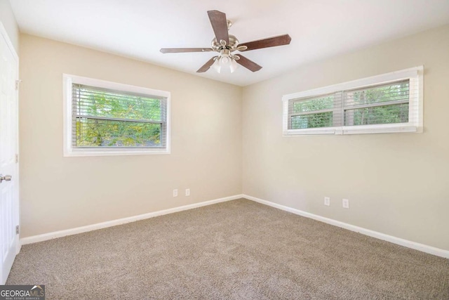 2910 Delowe Dr, Atlanta, GA 30344 - carpeted empty room with healthy amount of natural light, baseboards, and a ceiling fan