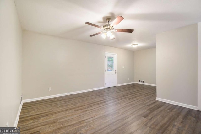 2910 Delowe Dr, Atlanta, GA 30344 - empty room with ceiling fan, dark wood-style flooring, and baseboards