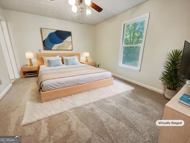 carpeted bedroom with ceiling fan