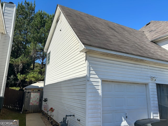 view of side of home with a garage