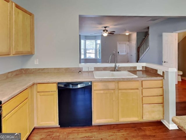 kitchen featuring light hardwood / wood-style floors, black dishwasher, sink, ceiling fan, and light brown cabinetry