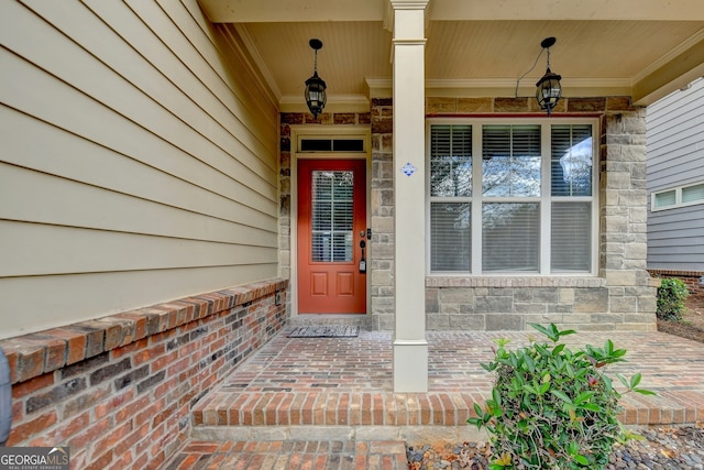 property entrance featuring a porch