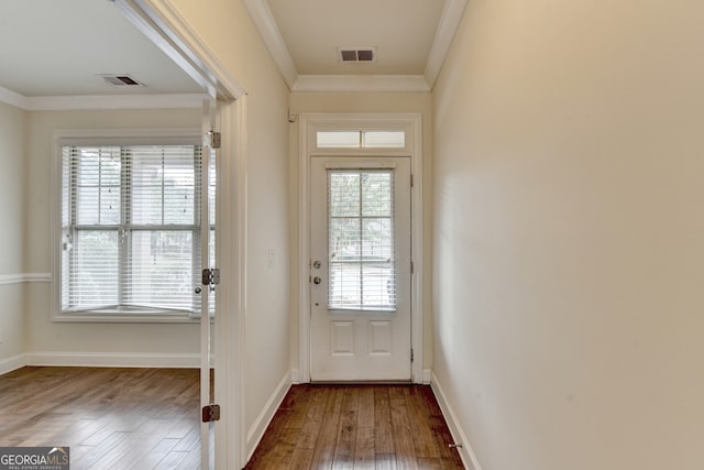 entryway with hardwood / wood-style flooring and crown molding