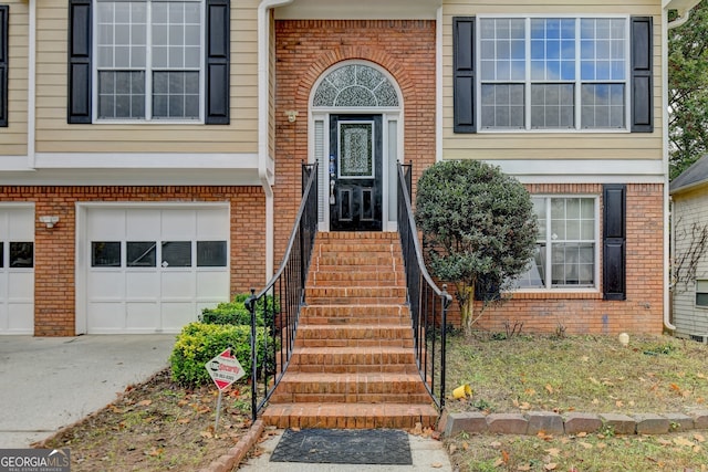 entrance to property featuring a garage