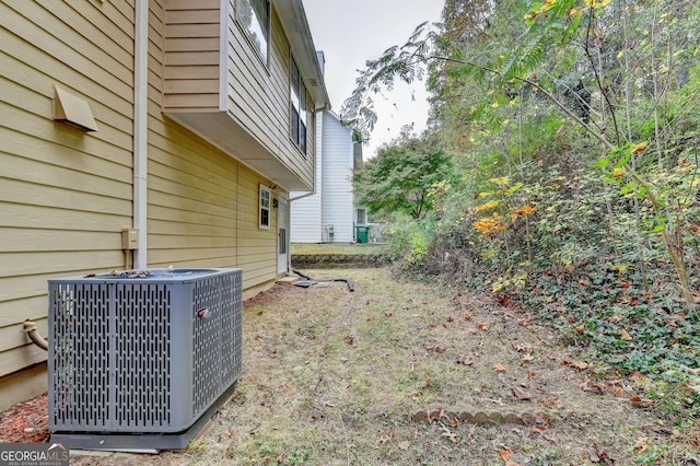 view of yard with central AC unit