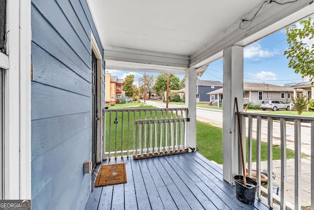 wooden deck featuring covered porch