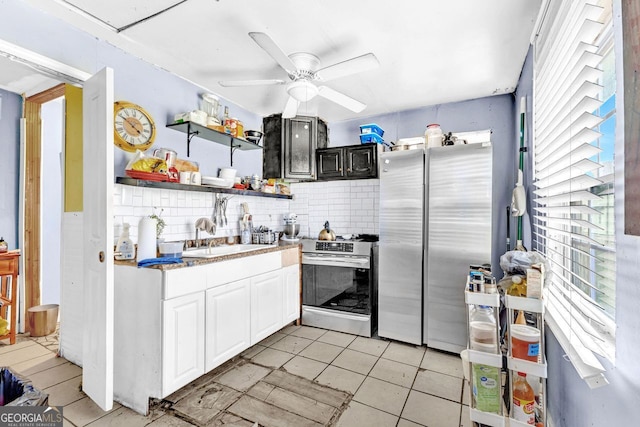 kitchen featuring decorative backsplash, sink, ceiling fan, white cabinetry, and appliances with stainless steel finishes