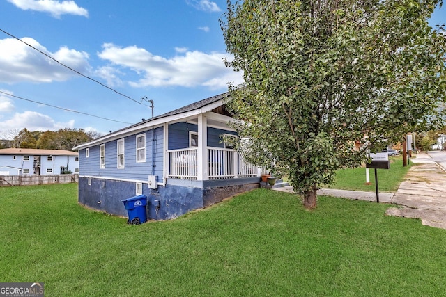 view of property exterior with a lawn