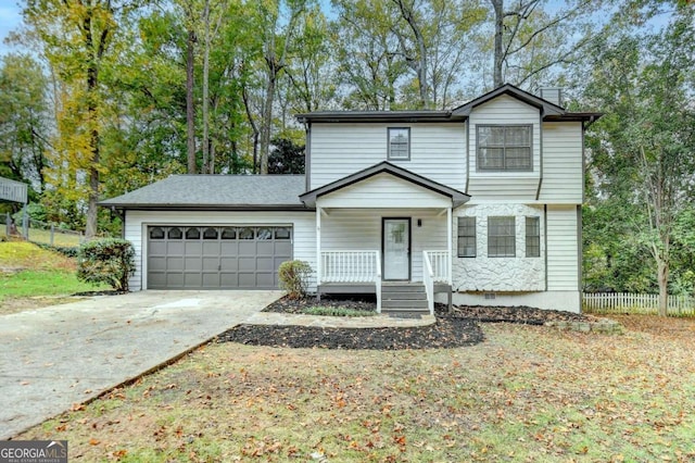 view of front property with a garage and a porch