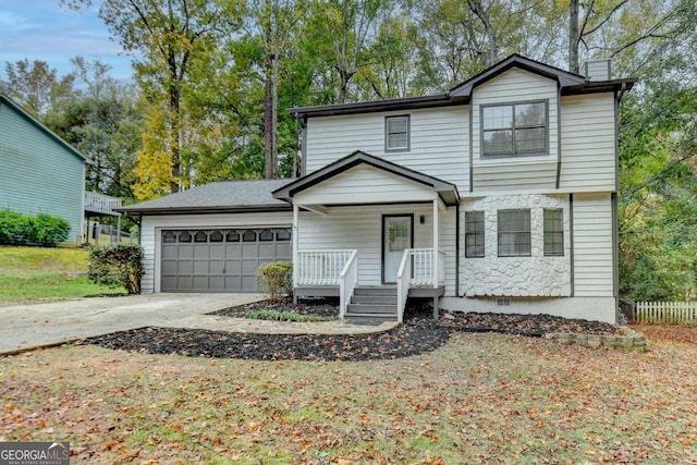 front of property with a garage and covered porch