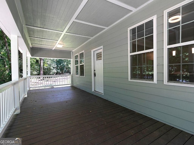 wooden deck featuring covered porch