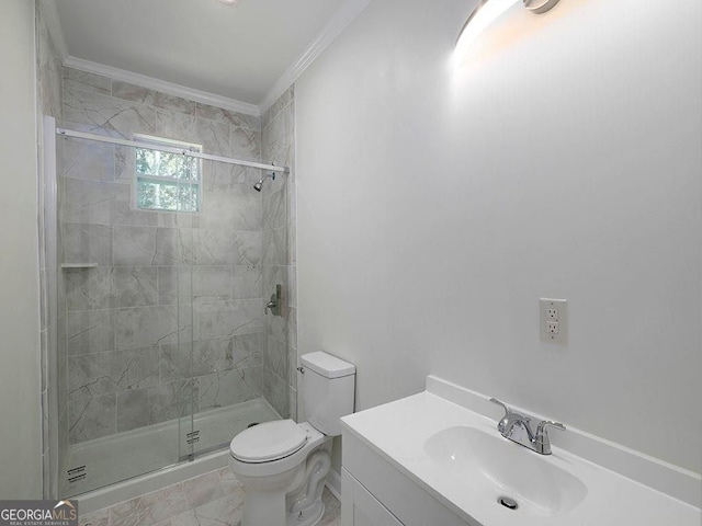 bathroom featuring ornamental molding, vanity, toilet, and a shower with door