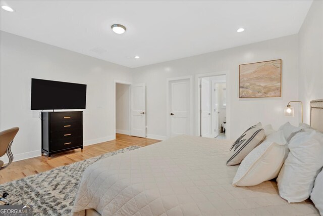 bedroom with light hardwood / wood-style floors