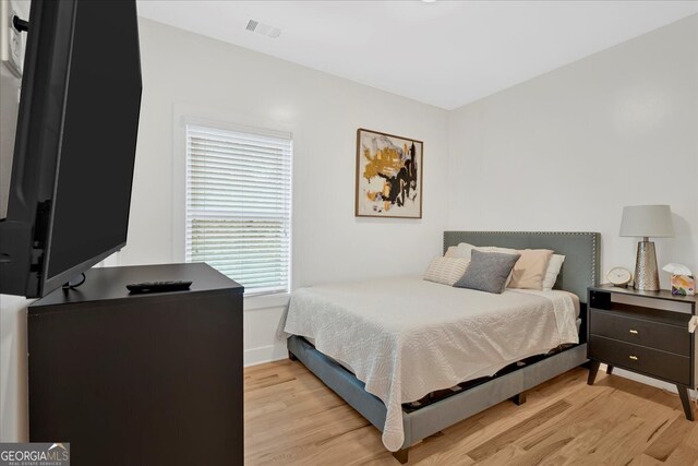 bedroom with light hardwood / wood-style floors