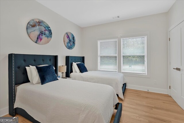 bedroom featuring wood-type flooring