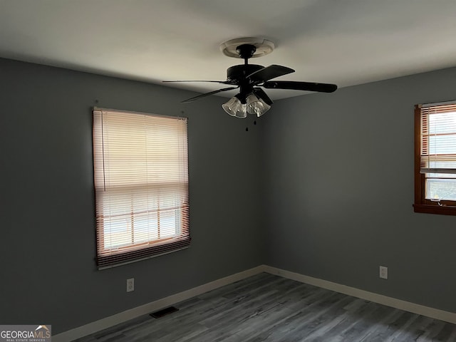 spare room featuring ceiling fan and hardwood / wood-style flooring