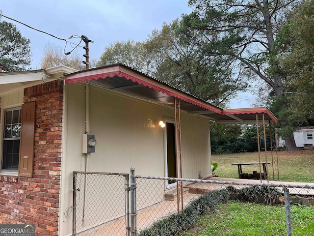 view of side of property with a lawn