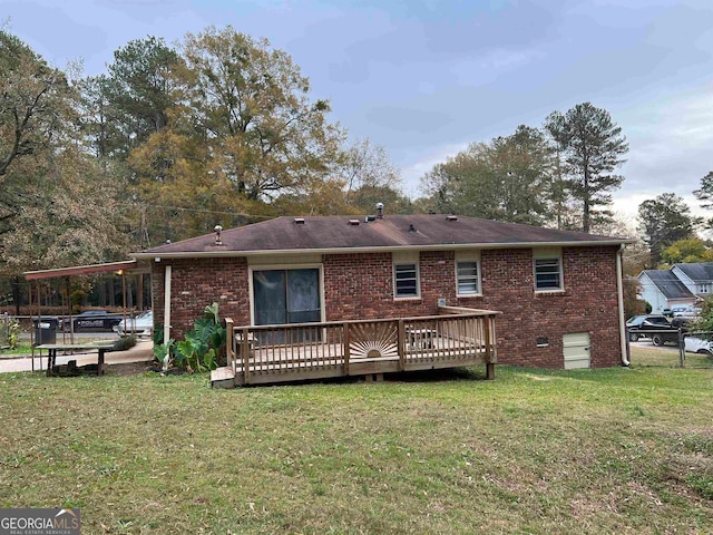 back of house with a wooden deck and a lawn