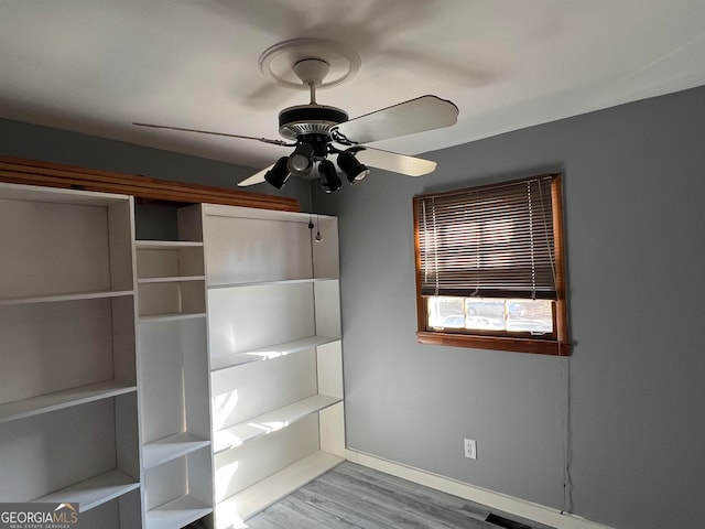 unfurnished bedroom featuring ceiling fan and light hardwood / wood-style flooring