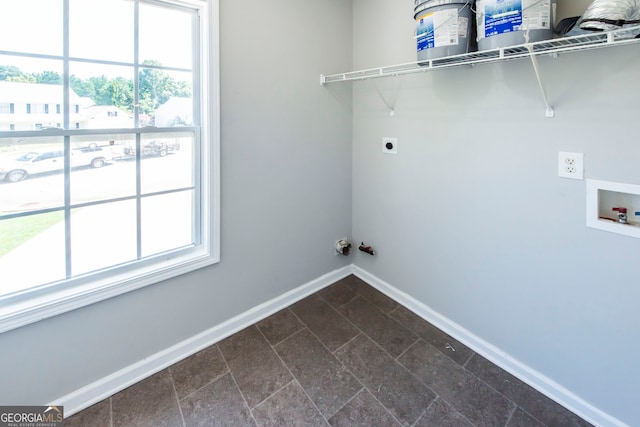 laundry area featuring washer hookup, plenty of natural light, and hookup for an electric dryer