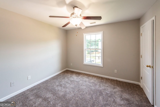 carpeted empty room with ceiling fan