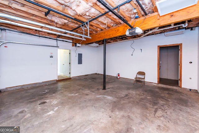 garage featuring electric panel and a garage door opener