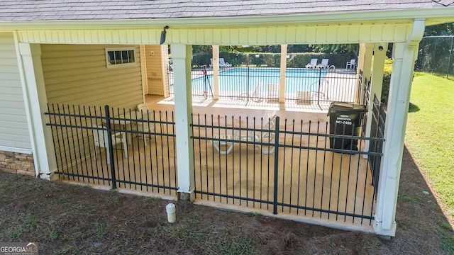 exterior space with a community pool and a patio area