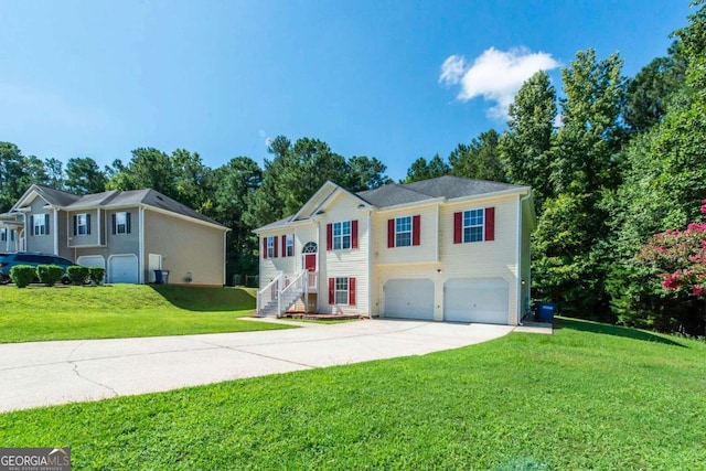 view of front of house with a garage and a front yard