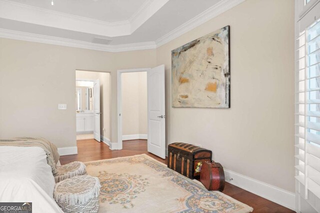 bedroom with hardwood / wood-style floors and crown molding