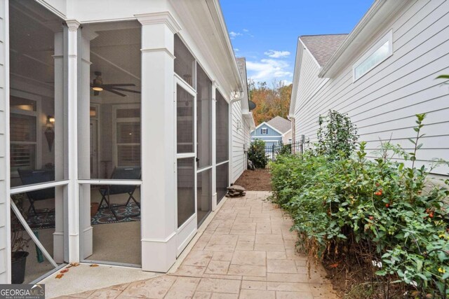 view of side of home with a sunroom