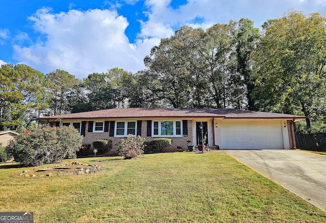 ranch-style house featuring a front lawn and a garage