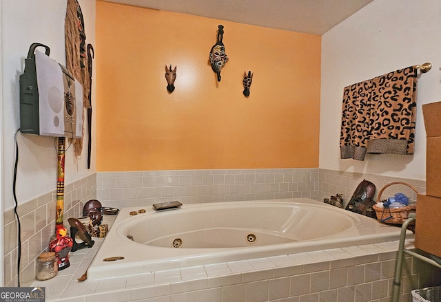 bathroom featuring tiled tub