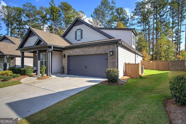 view of front of house with a front yard and a garage