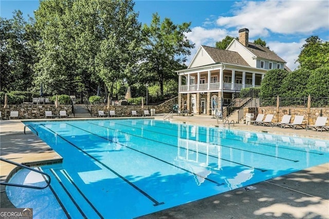 view of swimming pool with a patio