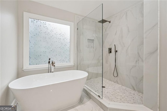 bathroom featuring separate shower and tub