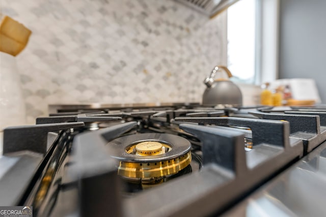 kitchen featuring pendant lighting, appliances with stainless steel finishes, custom exhaust hood, and gray cabinetry