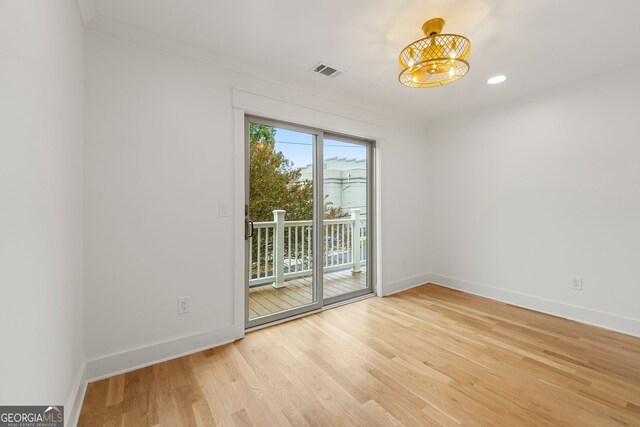 bedroom with light wood-type flooring and crown molding