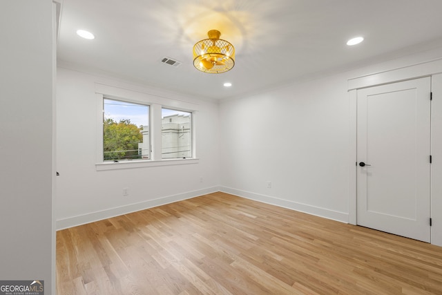 unfurnished bedroom with connected bathroom and light hardwood / wood-style flooring